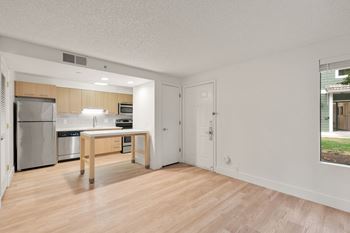 Living room with attached kitchen and window